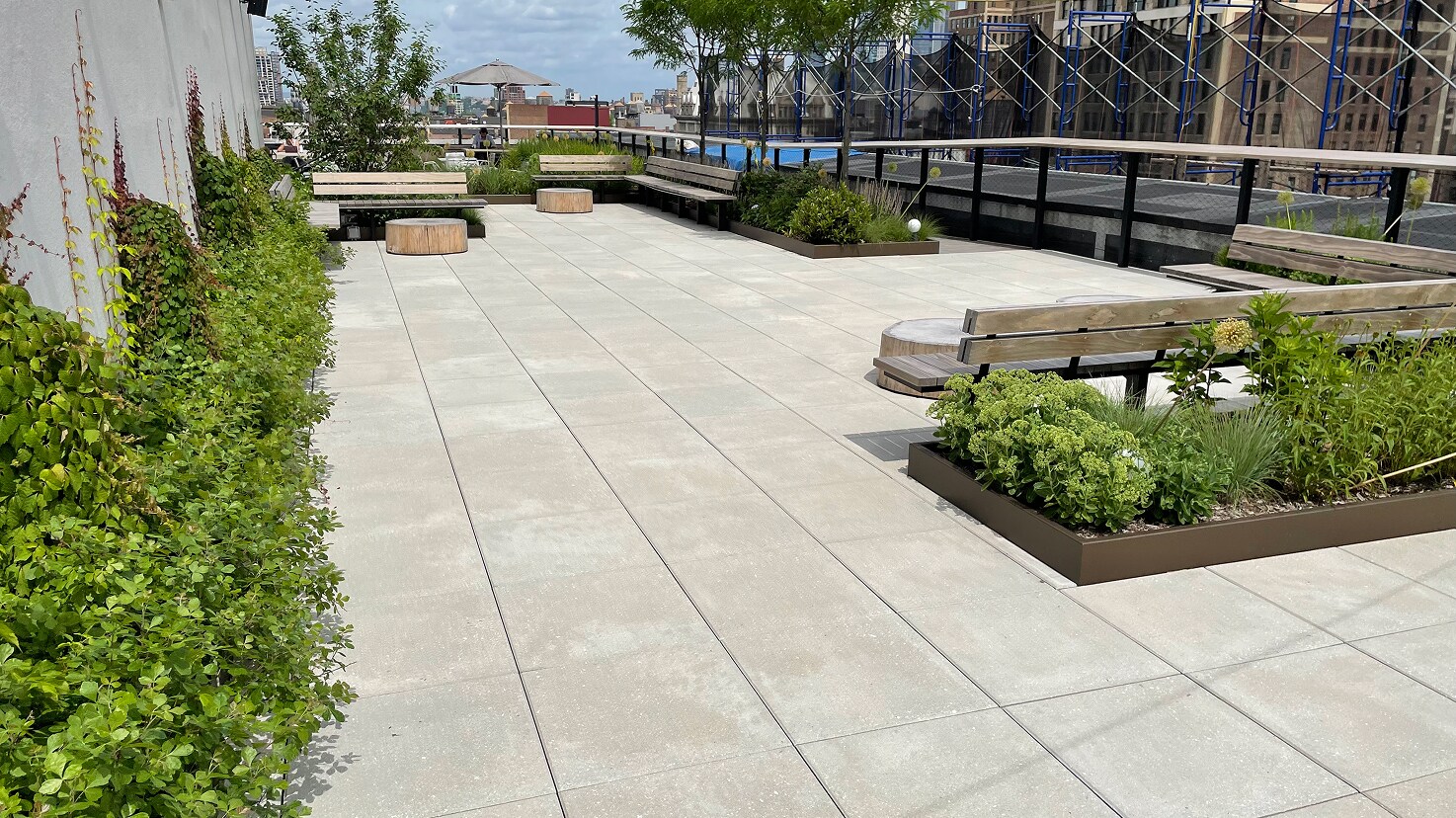 Amenity space with landscaping for stormwater management compatibility