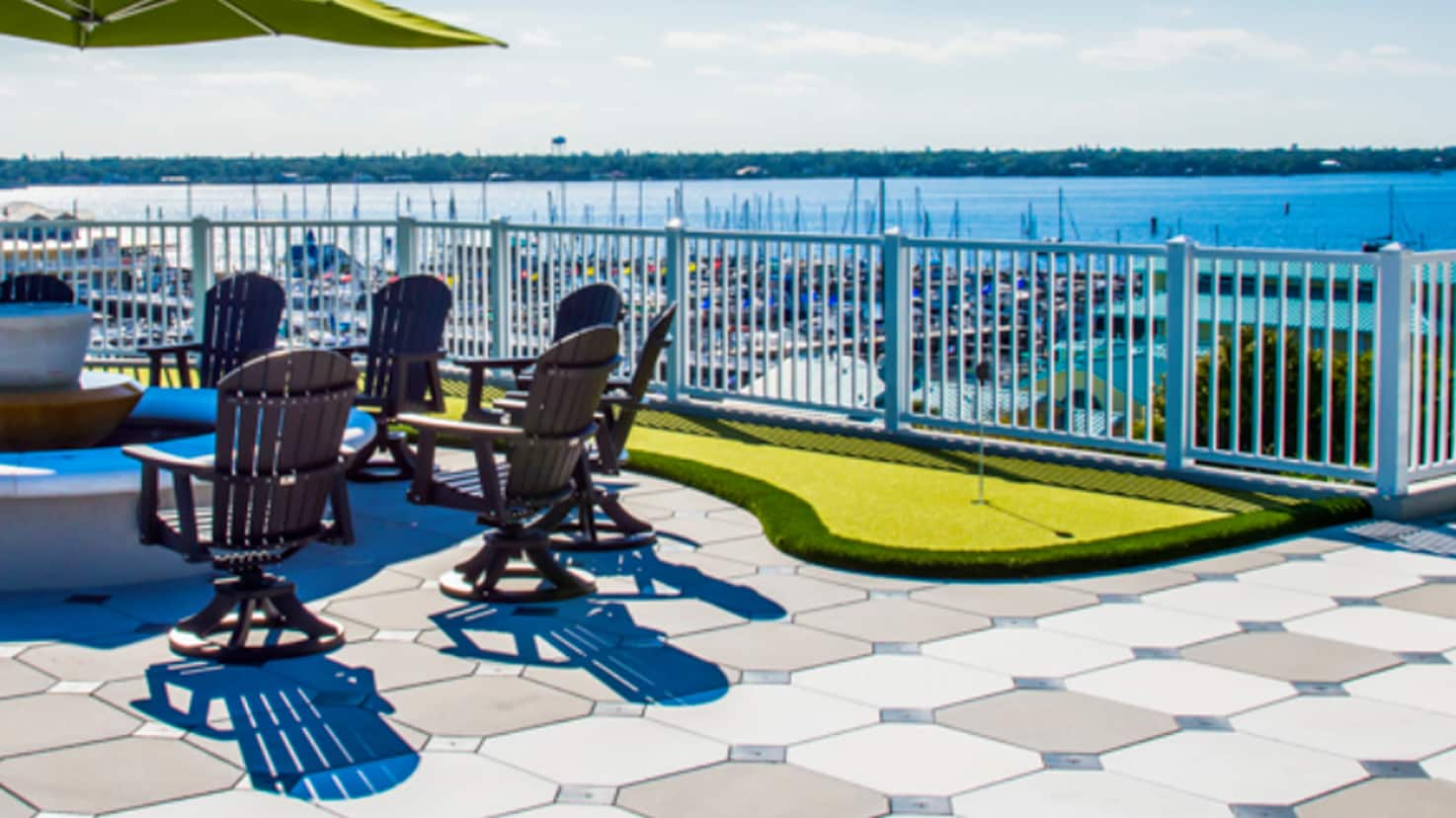 Wind-resistant amenity space with outdoor seating and water feature