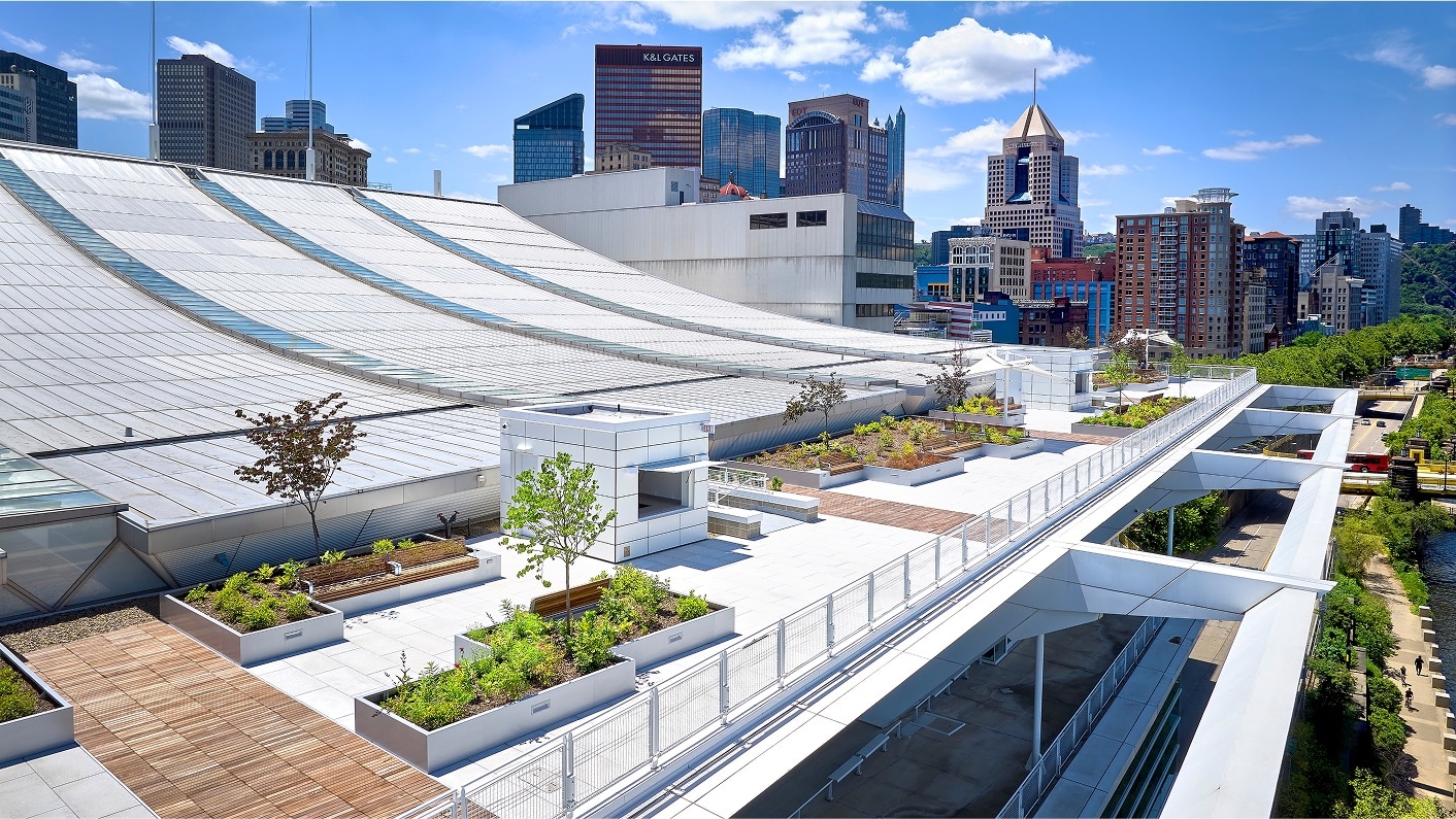 Rooftop amenity space at the David L. Lawrence Convention Center, with green planters and a city skyline.