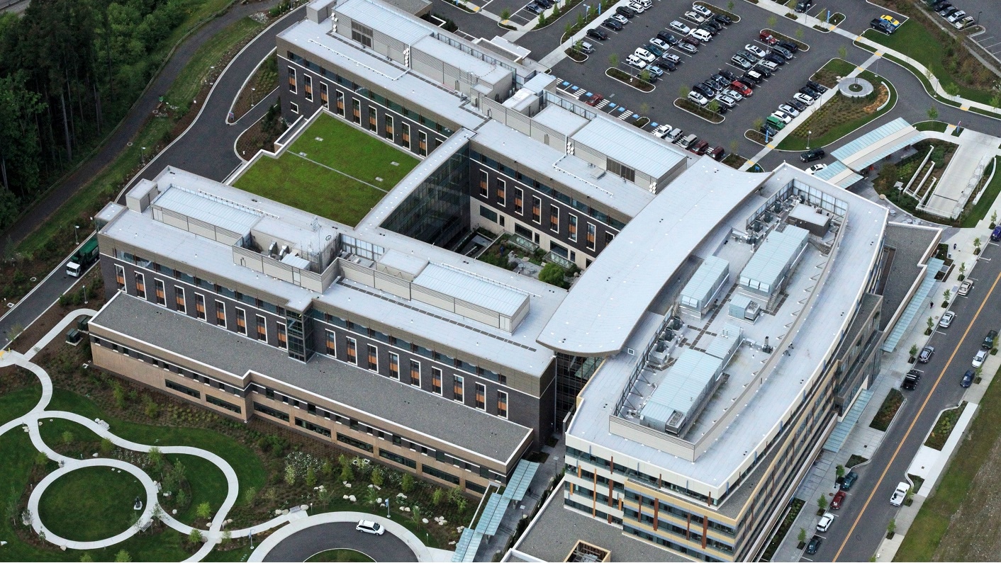 Aerial view of Swedish Hospital, showing its large building complex and extensive green roofs.